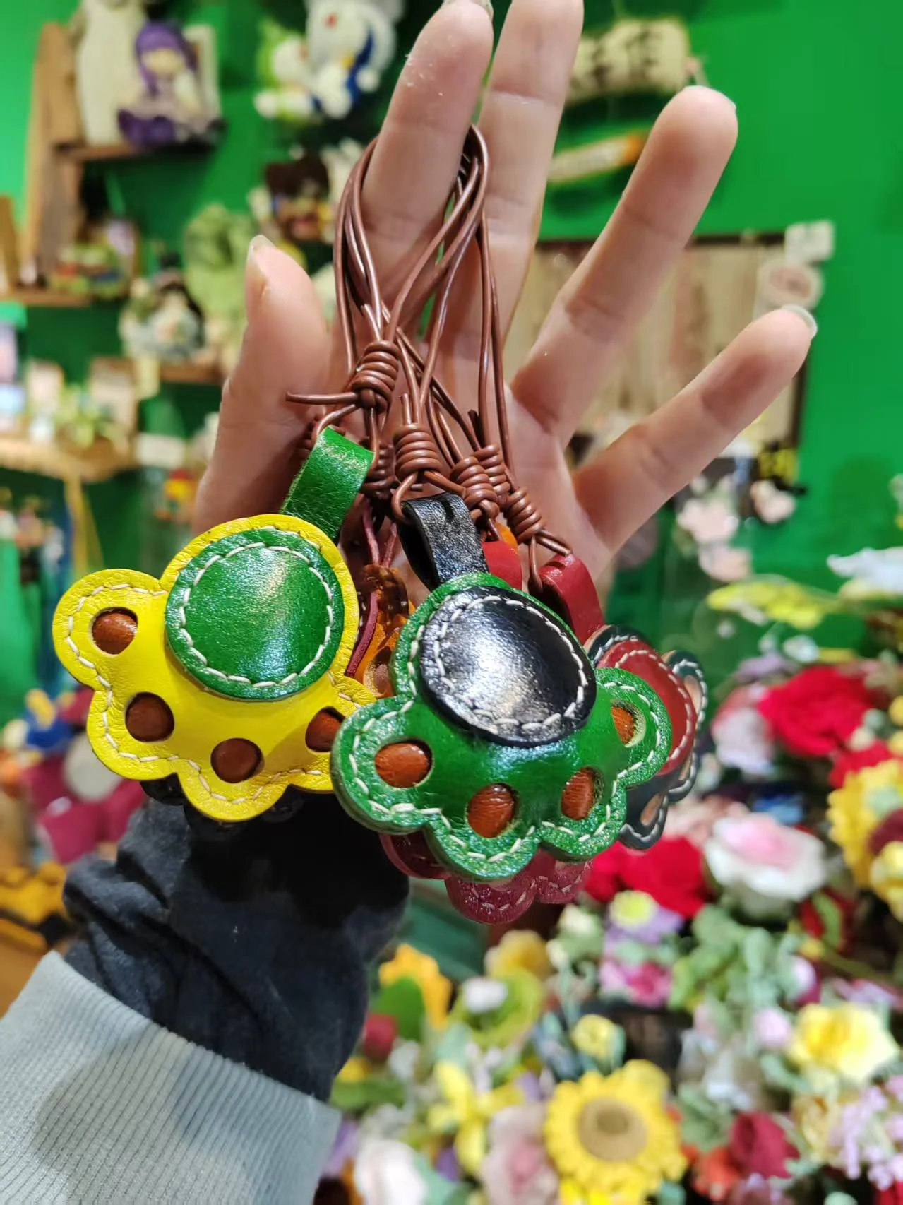 Lucky Paw Leather Pendant held in hand