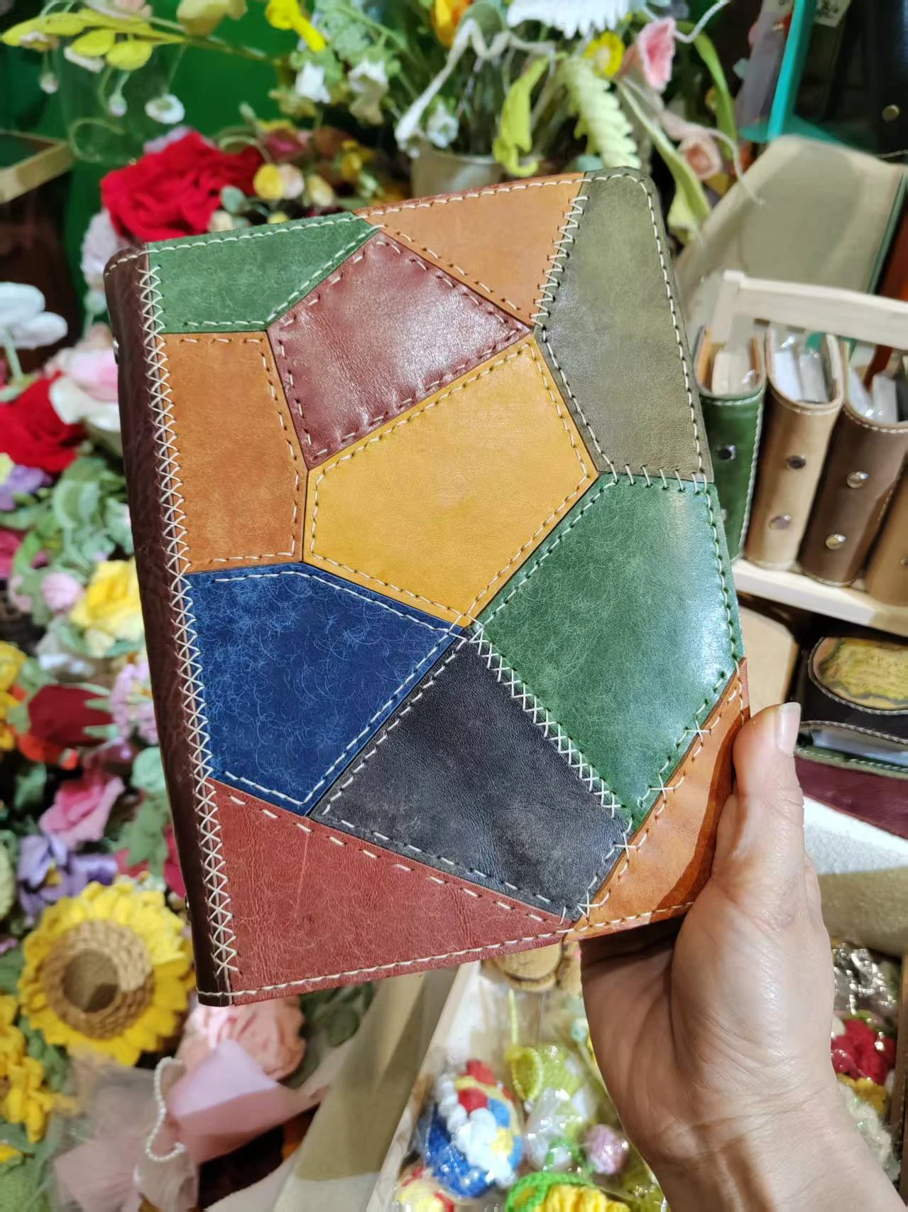 Front view of colorful handmade patchwork leather notebook